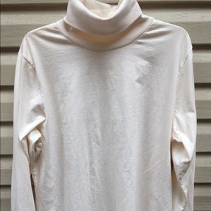 Woman Within Turtleneck in Cream